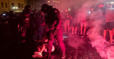 West Ham fans fight riot police and throw missiles after European triumph in Prague