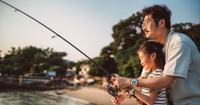 Dad slammed for teaching teen daughter how to gut fish as he claims it's a 'life skill'