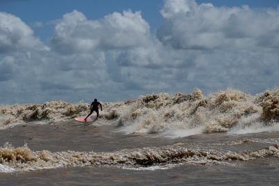 Surfers at Amazon's mouth ride some of world's longest-lasting waves
