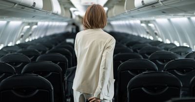 Woman claims her 'rights were violated' after '35 stone passenger sat on top of her' on flight