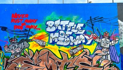 Graffiti-style mural near Southwest Side Orange Line L stop features ‘Trains-formers’