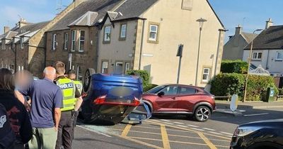 Edinburgh street closed after car overturns in quiet neighbourhood