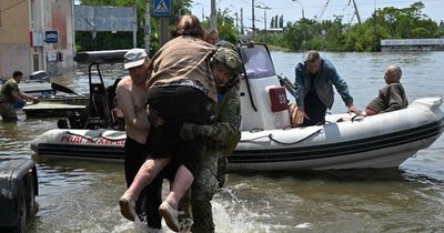 Rescuers drop water to stranded boy amid fallout from Ukraine dam bombing