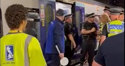 Football and music fans try to squeeze into impossibly full last train from Manchester to Liverpool