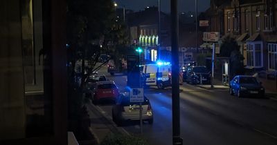 Police tape off road as woman taken to hospital after 'falling from van'