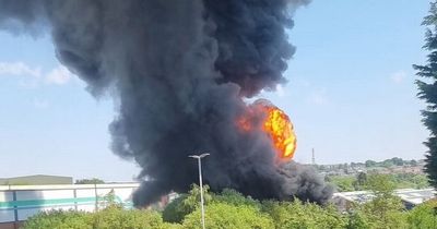 'Explosion' sparks massive fire with huge plumes of black smoke filling sky