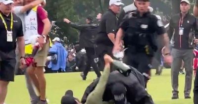 Professional golfer Adam Hadwin tackled by security trying to celebrate Nick Taylor's Canadian Open win