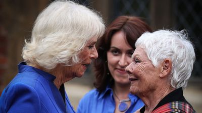 Queen Camilla almost misses important engagement as she arrives just in time to embrace Judi Dench