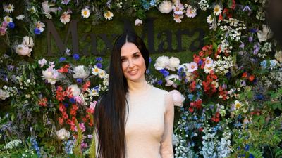 Demi Moore makes a serious style statement with poker-straight waist-length hair and cool maxi dress