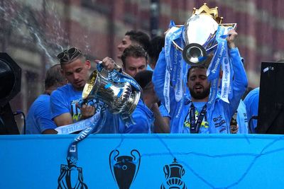 Rain and threat of lightning fail to dampen Manchester City’s trophy parade