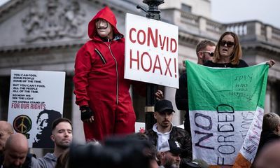 Quarter in UK believe Covid was a hoax, poll on conspiracy theories finds