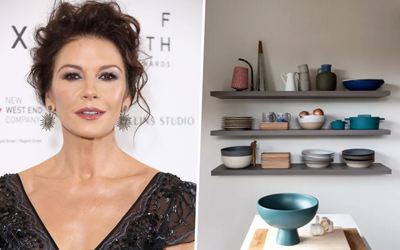 Catherine Zeta-Jones' display shelf is an example of how to decorate awkward empty spaces in a kitchen