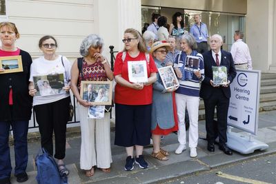 Bereaved families hold pictures of loved ones in vigil outside Covid inquiry
