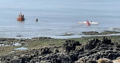 Plane crashes into the sea in front of shocked beachgoers in Wales