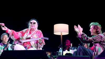 Joni Mitchell returns to the stage during a 25-song set playing a Parker Fly guitar
