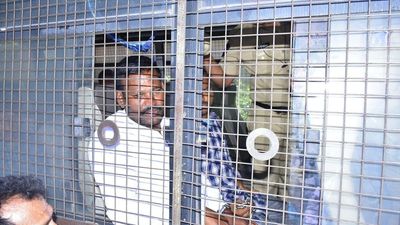 Four farmers handcuffed while being taking to court