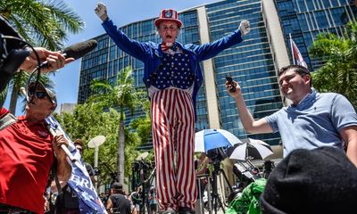 A silent and sullen Trump goes before judge in Miami – amid din outside