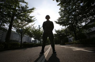 Two killed, one wounded in shooting at Japan military range