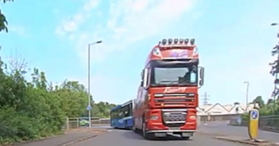 Terrifying video shows Scots driver swerve to avoid lorry towing McGills bus in near-miss
