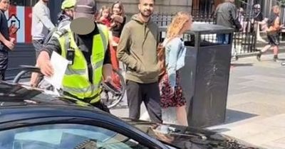 Smiling Edinburgh parking attendant spotted dishing out fines at Gumball 3000 rally