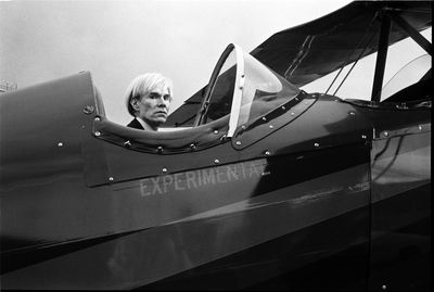 Andy Warhol piloting John Denver’s experimental bi-plane: Christopher Makos’s best photograph