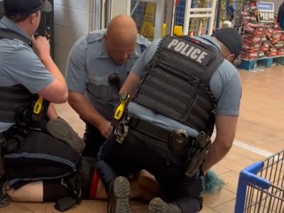 Kansas City police officer kneels on man’s neck in mistaken arrest over $5 Walmart frozen pizza