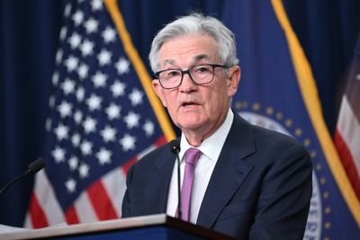 Fed pauses interest rate hikes but signals more tightening ahead