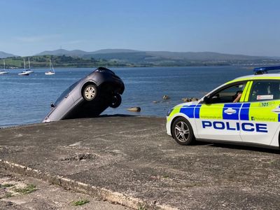 Police called after car rolls off end of slipway in Gourock