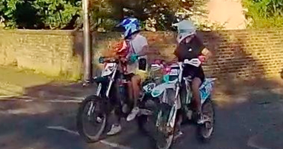 Reckless Midlothian dirt bike rider filmed with child on fuel tank in busy road