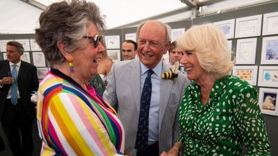 Queen Camilla steps out in forest green polka dot dress and charming bee brooch for the Bee Garden Party