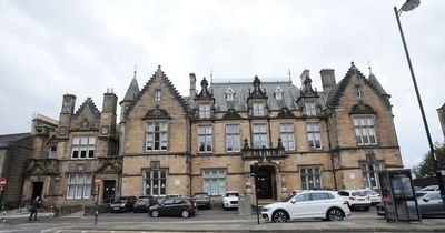 Stirling man warned after waving knife while hanging out of window