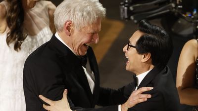 Ke Huy Quan surprises Harrison Ford at Indiana Jones and the Dial of Destiny premiere