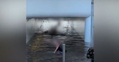 Moment kids SWIM in flooded underpass as water bursts from street hydrant