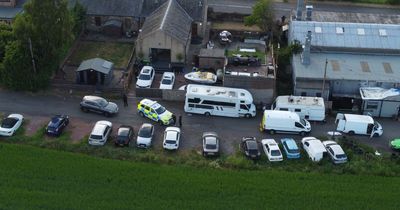 Armed police scour Midlothian town during hunt for escaped gangster prisoner