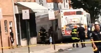 Bus crashes into building leaving 17 injured with reports of people 'trapped' in collapse