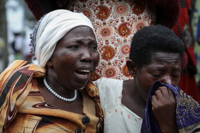 Ugandan border town prepares to bury victims of rebel massacre that left 42 dead, mostly students