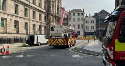 Window cleaners rescued by fire brigade after getting stuck on lift