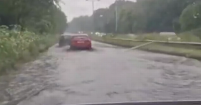 Alarming video shows A52 swamped as flash flooding hits busy road