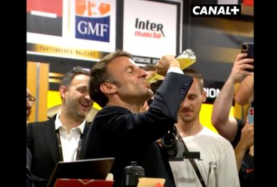Macron downs bottle of beer in 17 seconds in rugby dressing room
