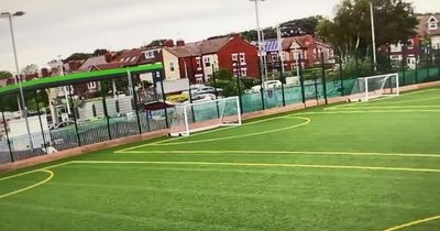 Man taken to hospital after car in Asda car park rammed into football pitch