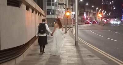 Glasgow newlyweds snapped holding hands during walk after ceremony in adorable photograph