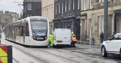 Side-splitting moment Edinburgh workmen try to lift van that was blocking tram