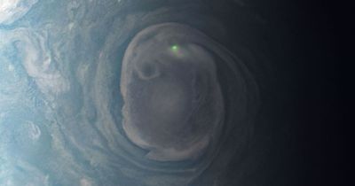 NASA spacecraft captures glowing green dot on Jupiter caused by a lightning bolt