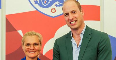 Prince William poses with Lionesses and takes them on at table football during royal visit