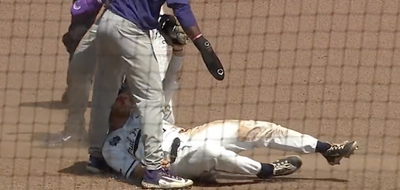 TCU was rightfully upset after a runner was called out despite getting pushed off the bag