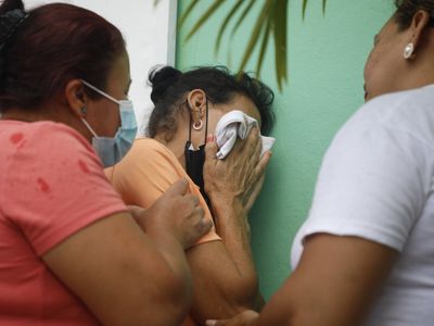 Dozens of women die in a grisly riot in Honduran prison the president blames on gangs