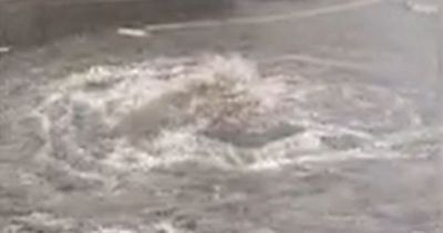 Glasgow torrential downpour causes burst pipe with street submerged and residents left without water