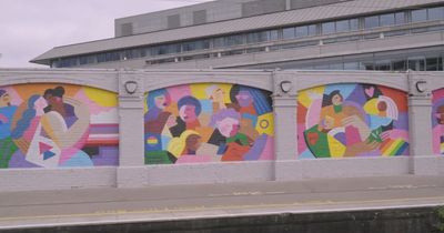 Striking new Pride street art mural unveiled at Tara Street station