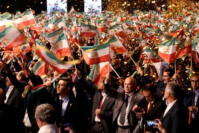 Why was this Iran dissident group raided in Europe?
