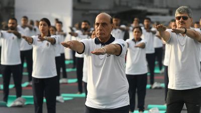 Defence Minister, Navy Chief perform yoga with defence personnel on board INS Vikrant